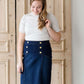 woman wearing a gray mock neck short sleeve top
