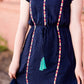 Navy midi dress with colorful embroidered accents 