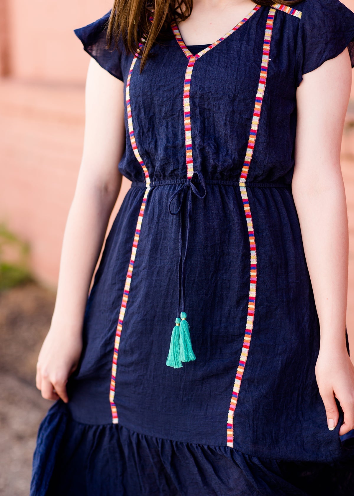 Navy midi dress with colorful embroidered accents 