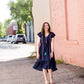 Navy midi dress with colorful embroidered accents 