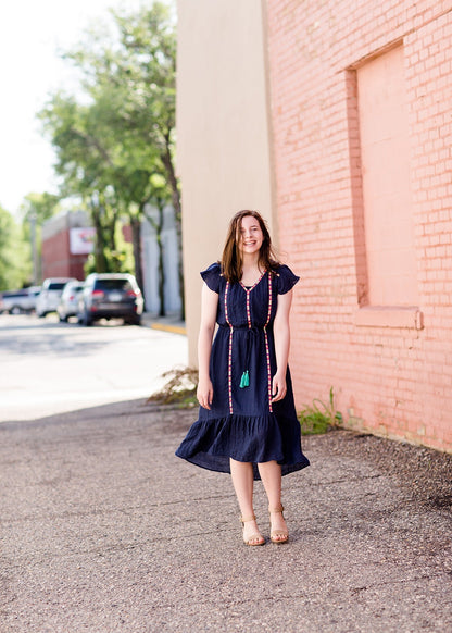 Navy midi dress with colorful embroidered accents 