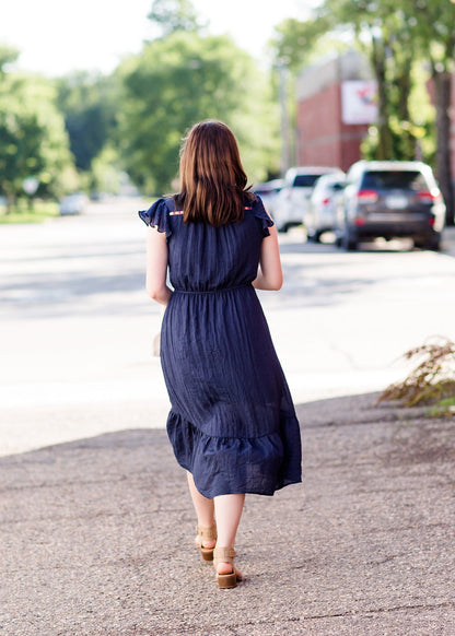 Navy midi dress with colorful embroidered accents 