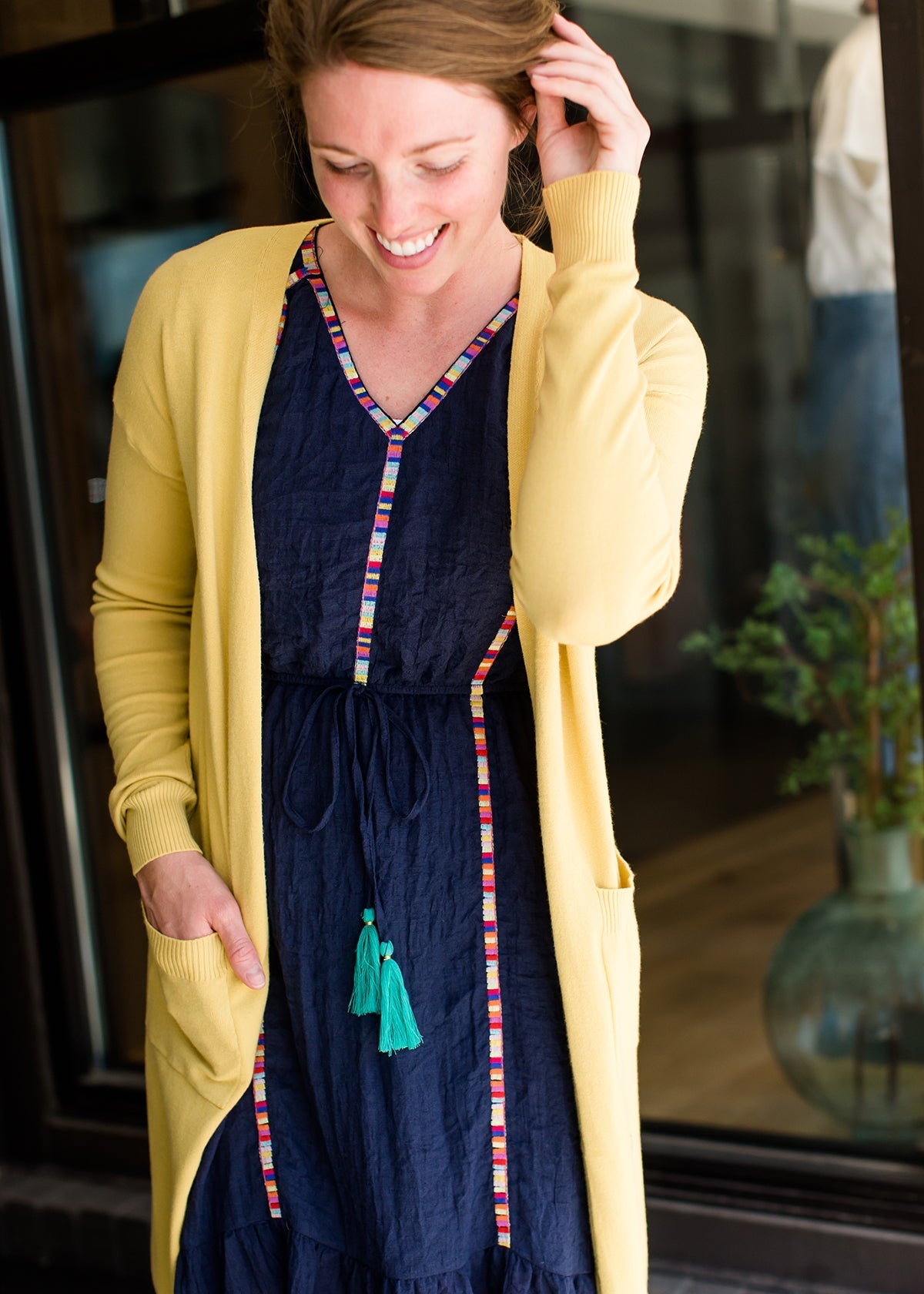 Navy midi dress with colorful embroidered accents 