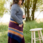 Long knit charcoal womens cardigan with orange and burgundy stripes