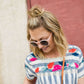 women's modest blue and white striped top with embroidered flowers