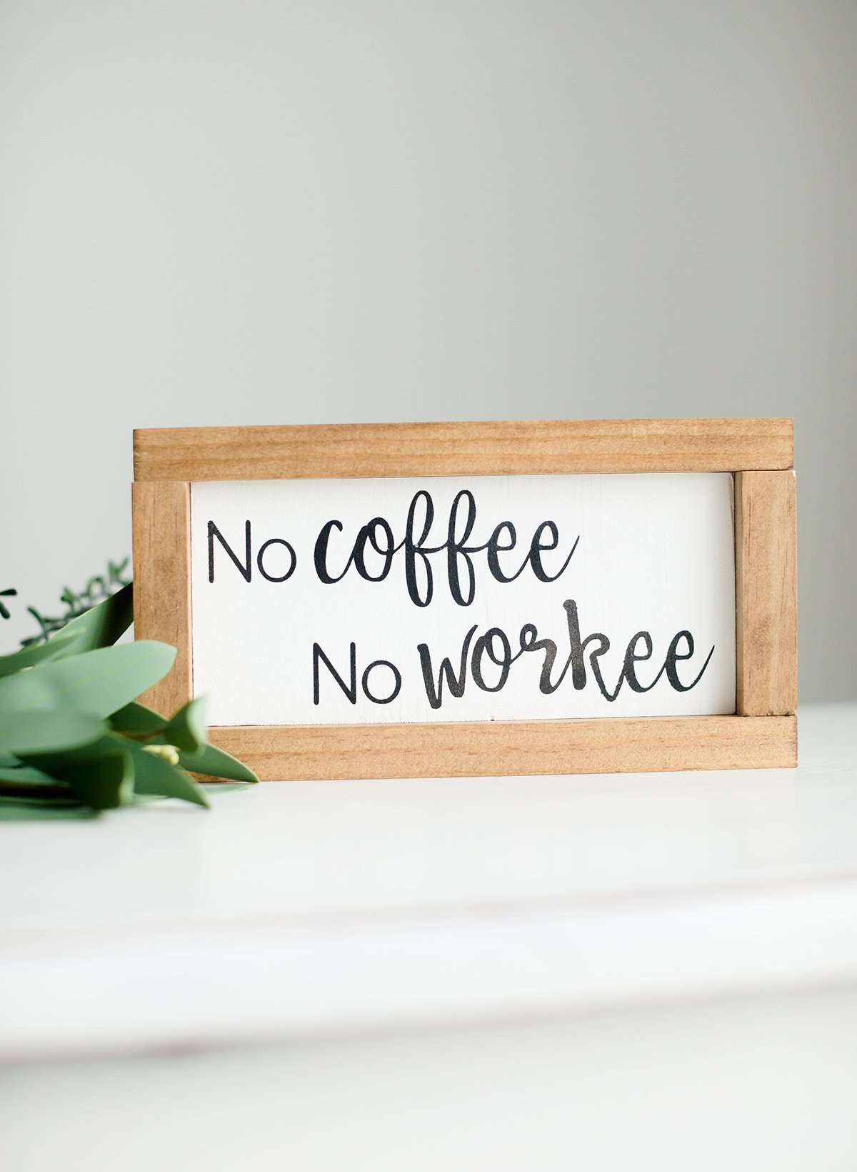 Wood Frame Signboard with the words, " no coffee, no workee" written in a playful font.