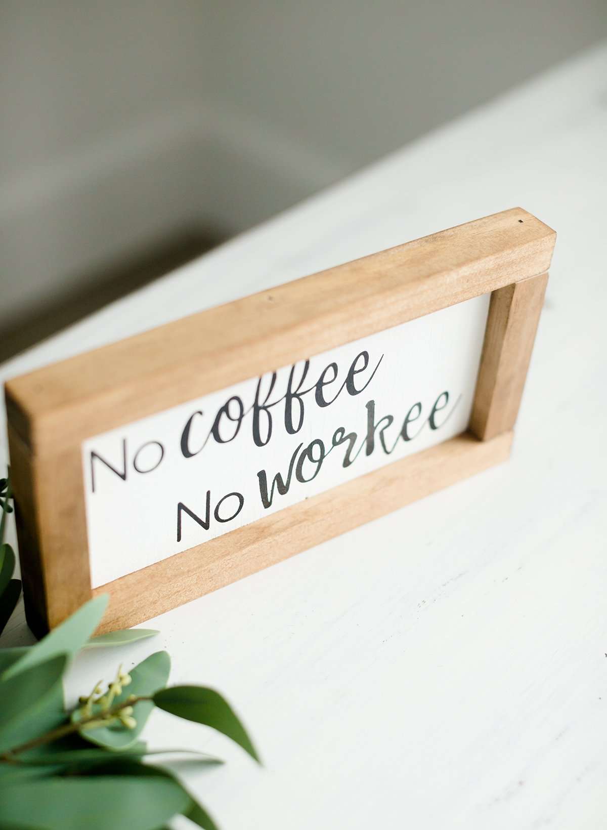 Wood Frame Signboard with the words, " no coffee, no workee" written in a playful font.