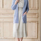 Woman wearing a green or coral waffle knit cardigan