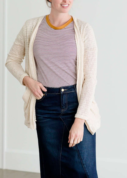 Woven cardigan that drapes and has front pockets. It comes in blush, cream and sage.