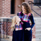 This half zip pullover features a front pouch pocket and a beautiful color block print of fuchsia, teal and mustard!  This young girl is also matching her mother in a mommy and me style.