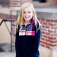This half zip pullover features a front pouch pocket and a beautiful color block print of fuchsia, teal and mustard!  This young girl is also matching her mother in a mommy and me style.