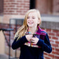 This half zip pullover features a front pouch pocket and a beautiful color block print of fuchsia, teal and mustard!  This young girl is also matching her mother in a mommy and me style.