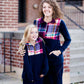 This half zip pullover features a front pouch pocket and a beautiful color block print of fuchsia, teal and mustard! It also is a mommy and me style.  