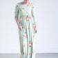 woman wearing a modest mint and floral maxi dress