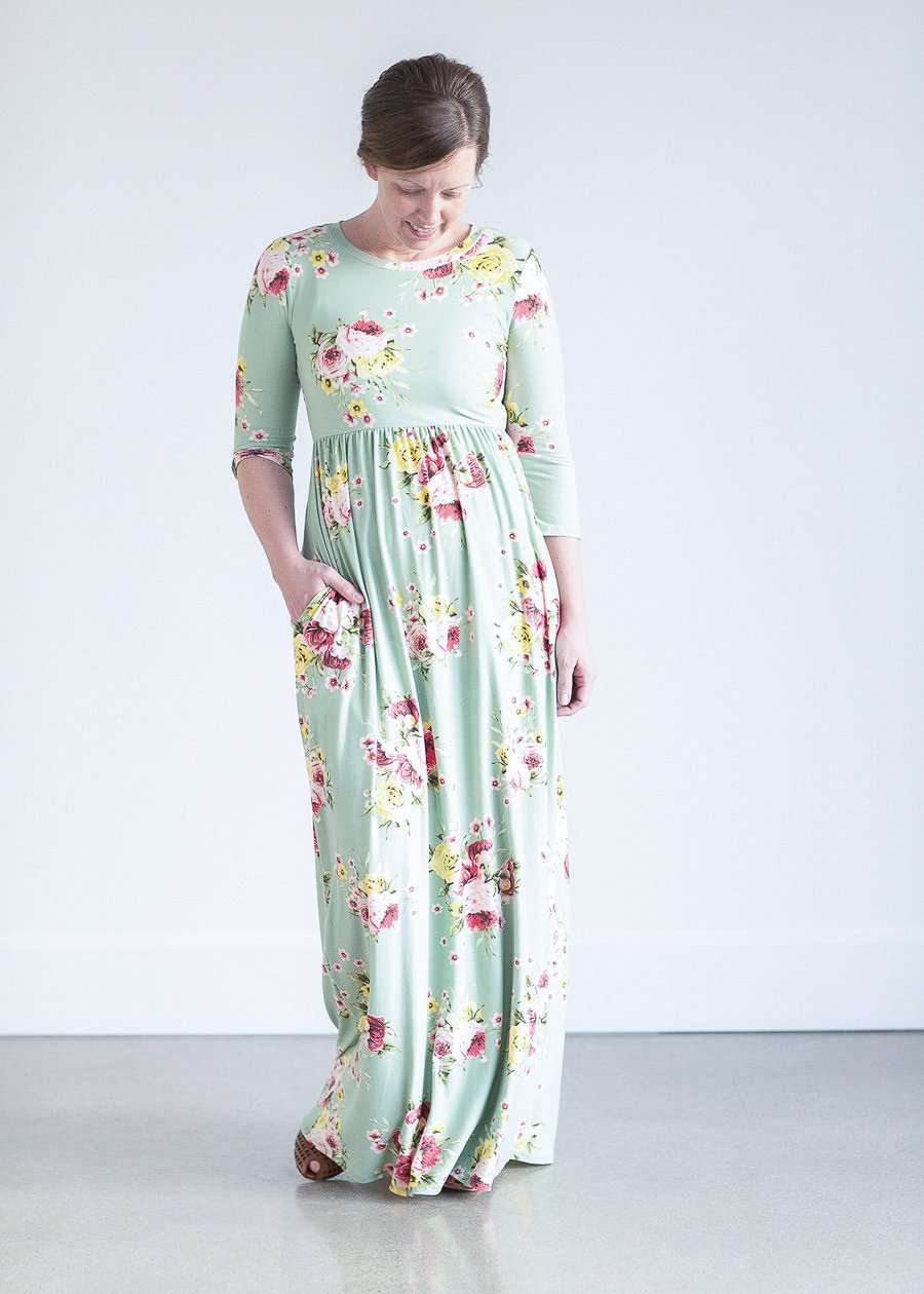 woman wearing a modest mint and floral maxi dress