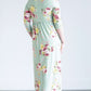 woman wearing a modest mint and floral maxi dress