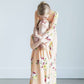 young girl wearing a modest mint and floral maxi dress
