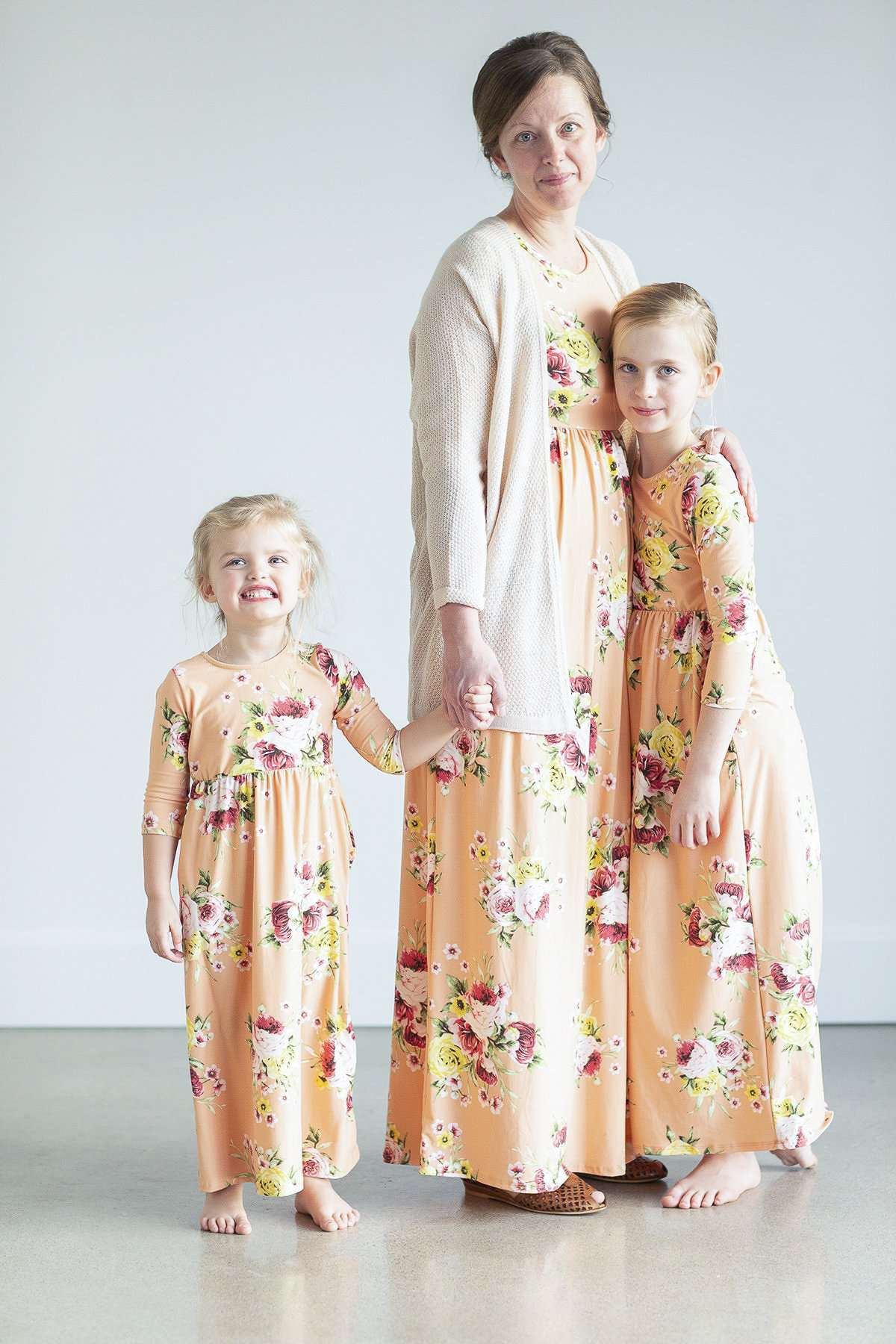 young girl wearing a modest mint and floral maxi dress
