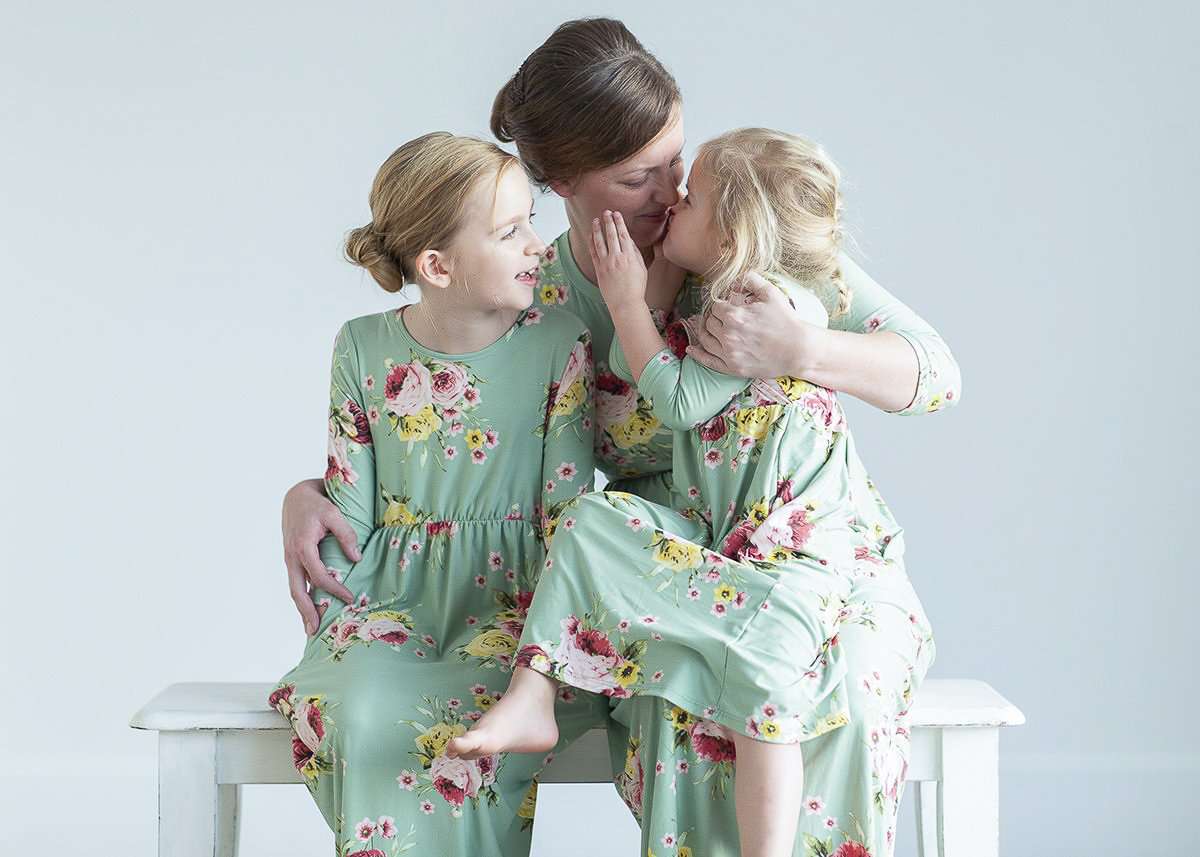 young girl wearing a modest mint and floral maxi dress
