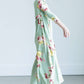 young girl wearing a modest mint and floral maxi dress