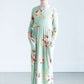 young girl wearing a modest mint and floral maxi dress