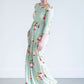 woman wearing a modest mint and floral maxi dress