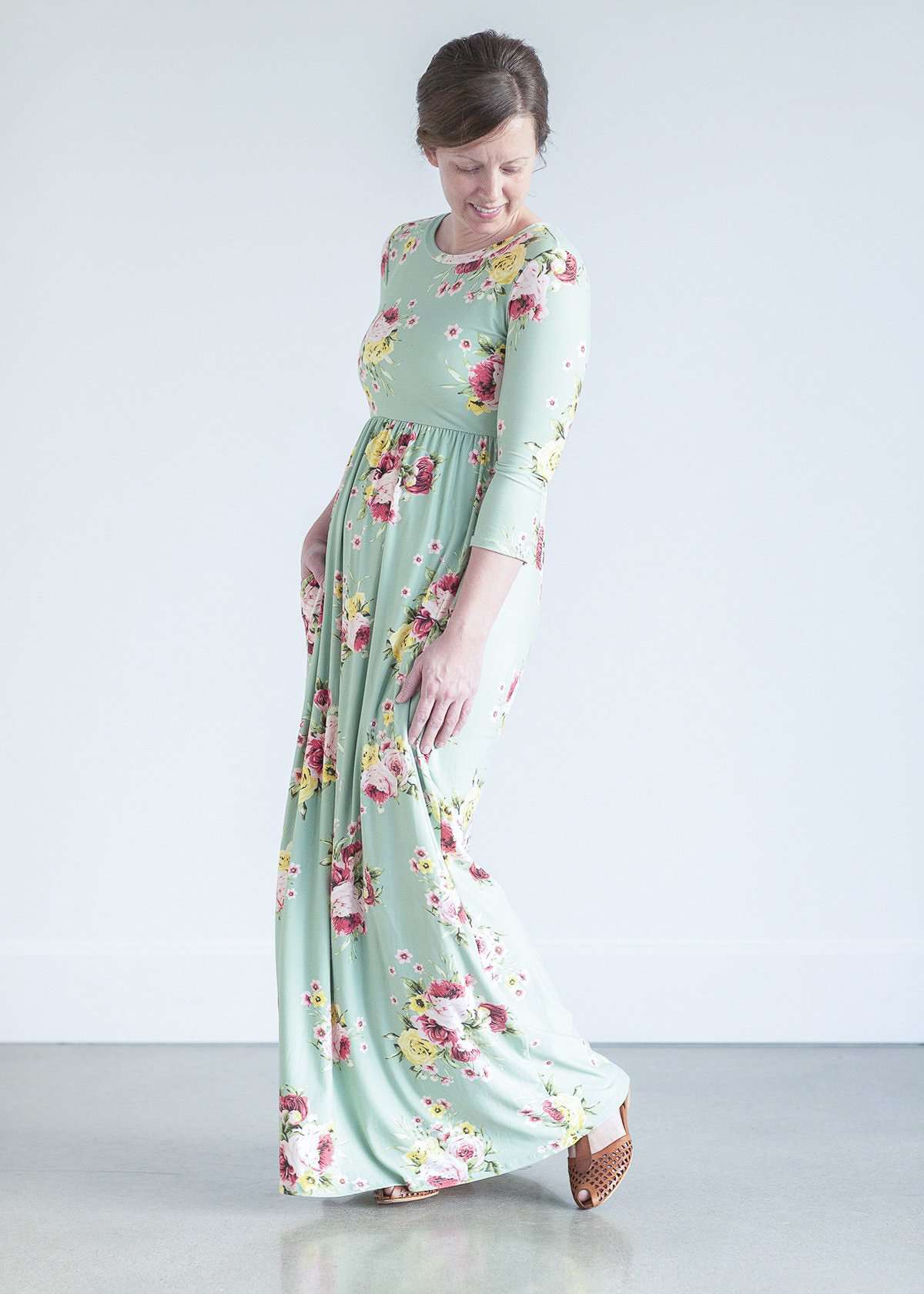 woman wearing a modest mint and floral maxi dress