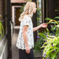 greenery patterned peplum white top with faux buttons on back