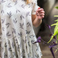 greenery patterned peplum white top with faux buttons on back