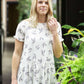 greenery patterned peplum white top with faux buttons on back