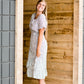 Cream and black side tie midi dress
