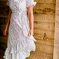 Cream and black side tie midi dress
