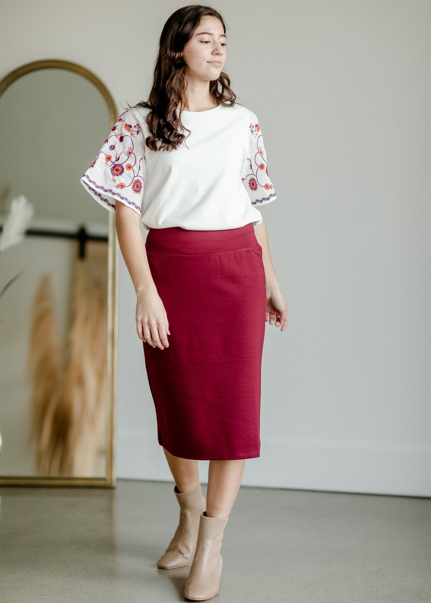 This is the quinn knit midi skirt that is made of high quality knit with a stretch waistband and is in a streight fit.