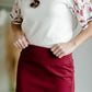 This is the quinn knit midi skirt that is made of high quality knit with a stretch waistband and is in a streight fit.