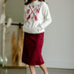 This is the quinn knit midi skirt that is made of high quality knit with a stretch waistband and is in a streight fit.