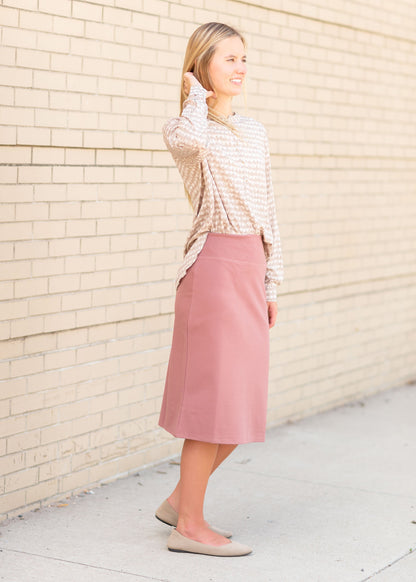An Inherit Exclusive, the Quinn Dusty Mauve Midi Skirt is super soft and always ready to go! Made of fabric that is almost always wrinkle free you can go about your day and head to supper at night knowing you'll still look put together! The thick, stretch waist band is slipping and supportive along with no pockets giving this skirt a no-bulk, super comfy fit. This modest knit skirt is ready for anything and the color is absolutely beautiful!