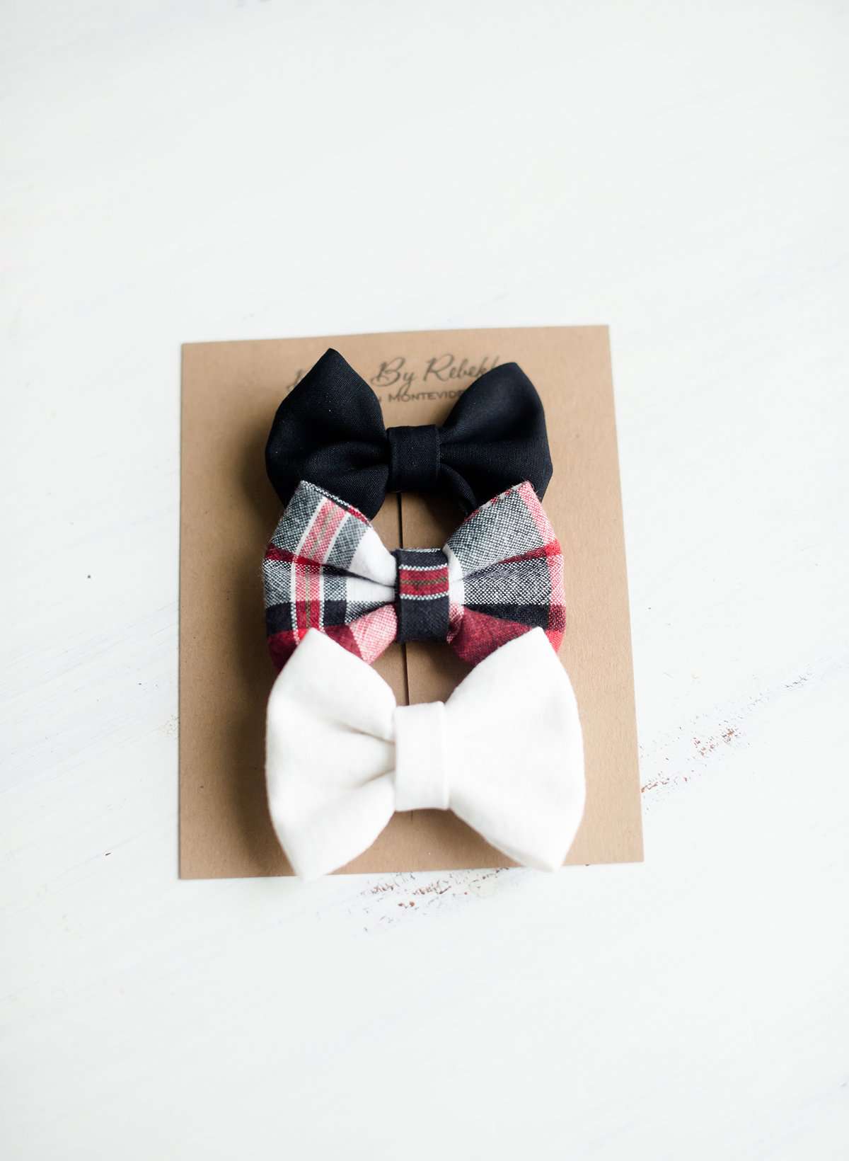 Little girls hair bow set of three. This shows a white, black and red plaid headband or alligator clip bow.