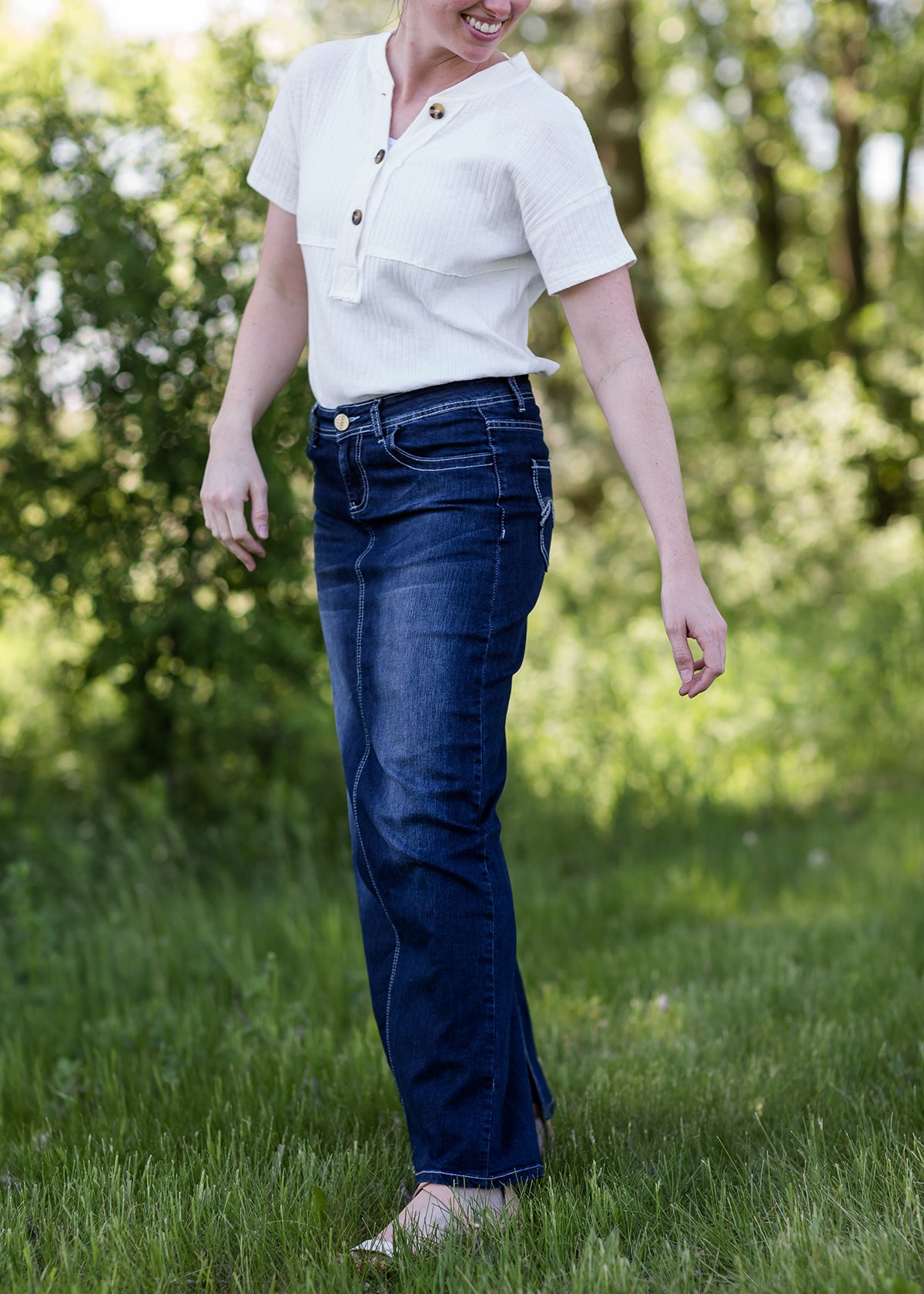 woman wearing a long dark denim jean skirt