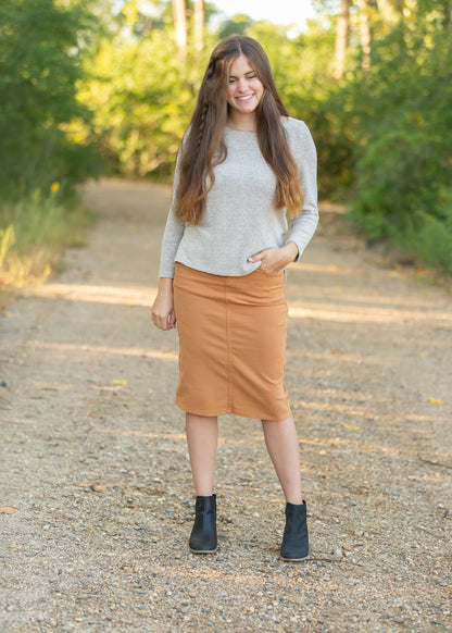 This Remi is a straight fit skirt that is a fan favorite Inherit Design. This burnt camel color is gorgeous and will go with all the things. It comes in sizes 26" + 29" lengths with a slit in the back for walkability.
