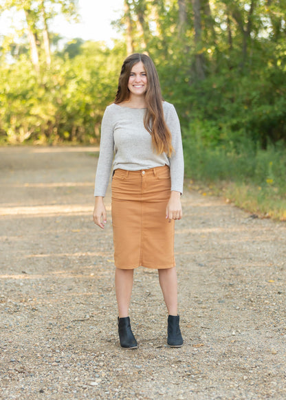 This Remi is a straight fit skirt that is a fan favorite Inherit Design. This burnt camel color is gorgeous and will go with all the things. It comes in sizes 26" + 29" lengths with a slit in the back for walkability.