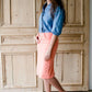 modest coral colored denim midi skirt