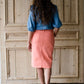 modest coral colored denim midi skirt