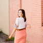 modest coral colored denim midi skirt