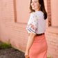 modest coral colored denim midi skirt