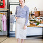 Woman wearing a gray below the knee skirt