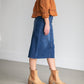 An Inherit Exclusive, the Remi Raw Hem Dark Denim Midi Skirt is cut with a modest and classic straight fit. This dark denim skirt has a raw bottom hem and will be a go-to time and time again for any occasion! The slight distressing at the hip adds fun style to your closet without any thought at being dressy or casual as it is definitely both! This skirt has awesome stretch for total comfort and no back slit while still allowing for unconstrained walking.