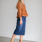 An Inherit Exclusive, the Remi Raw Hem Dark Denim Midi Skirt is cut with a modest and classic straight fit. This dark denim skirt has a raw bottom hem and will be a go-to time and time again for any occasion! The slight distressing at the hip adds fun style to your closet without any thought at being dressy or casual as it is definitely both! This skirt has awesome stretch for total comfort and no back slit while still allowing for unconstrained walking.