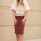 This Remi is a straight fit skirt that is a fan favorite Inherit Design. This rosewood color is gorgeous and will go with all the things. It comes in sizes 26" + 29" lengths with a slit in the back for walkability.
