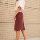 This Remi is a straight fit skirt that is a fan favorite Inherit Design. This rosewood color is gorgeous and will go with all the things. It comes in sizes 26" + 29" lengths with a slit in the back for walkability.