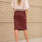 This Remi is a straight fit skirt that is a fan favorite Inherit Design. This rosewood color is gorgeous and will go with all the things. It comes in sizes 26" + 29" lengths with a slit in the back for walkability.